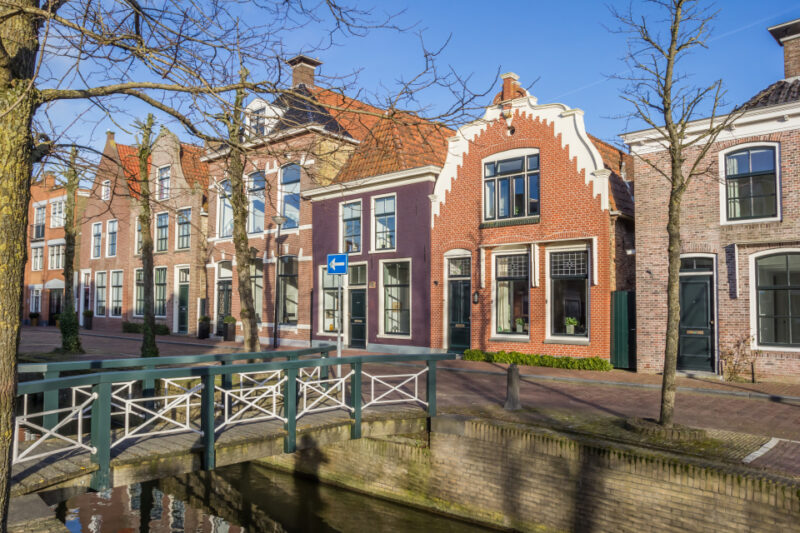 Colorful houses and a bridge at a canal in Franeker